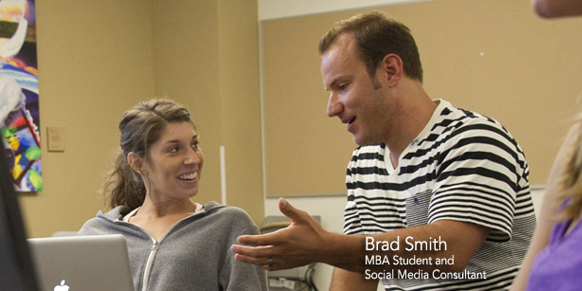 Brad Smith speaking with another student